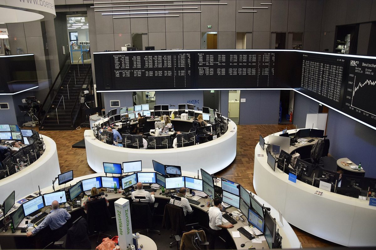 Trading floor with price boards and market data screens at a stock exchange